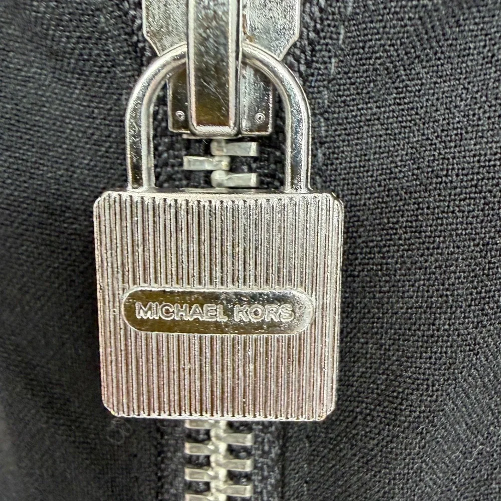 Michael Kors command attention